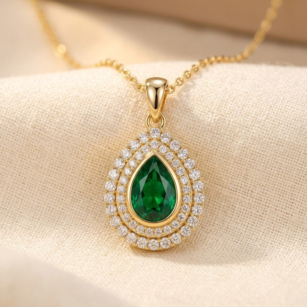 Collier goutte en or à émeraude