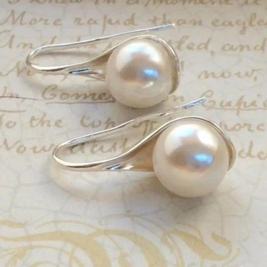 Boucles d'oreilles pendantes élégantes à perles