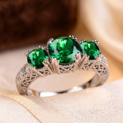 Bague trois pierres en argent à émeraude