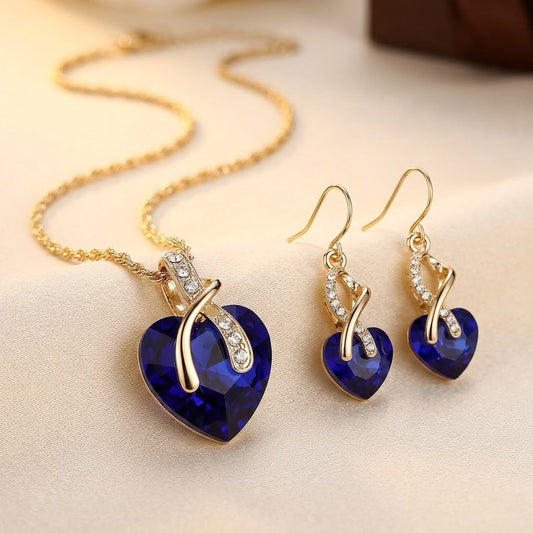 Parure collier et boucles d'oreilles cœur en or à saphir