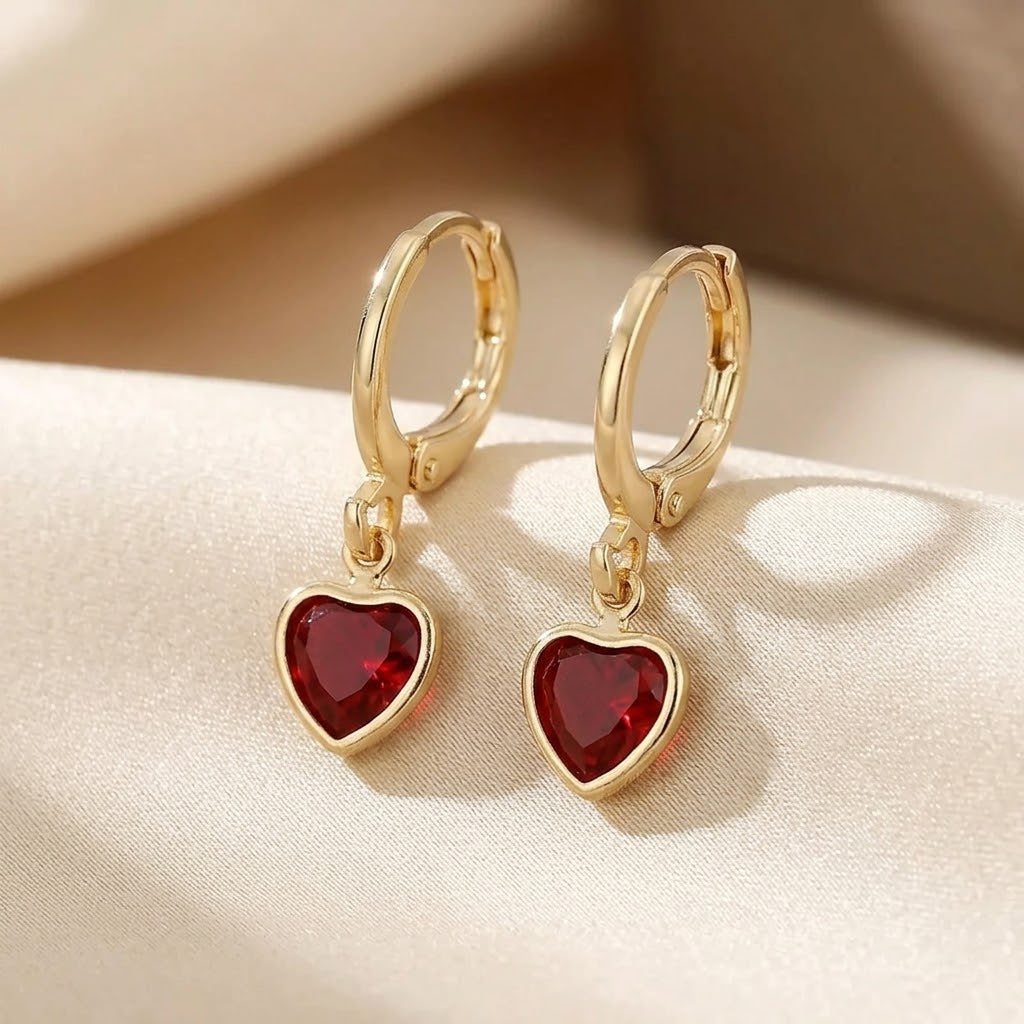Boucles d'oreilles pendantes cœur en or à rubis