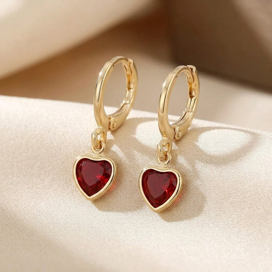 Boucles d'oreilles pendantes cœur en or à rubis