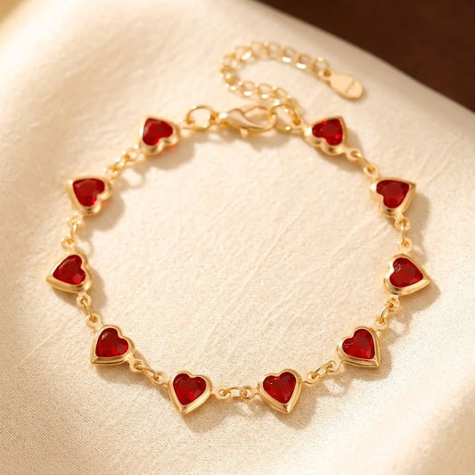 Bracelet chaîne cœur en or à rubis