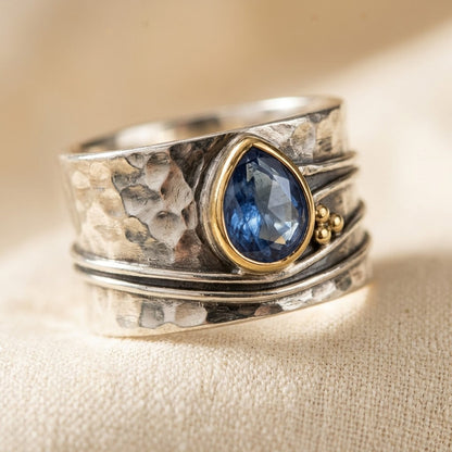 Bague serti clos en argent et or
