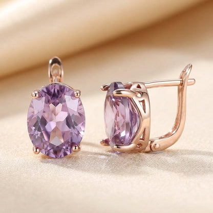 Puces d'oreilles en or rose à améthyste